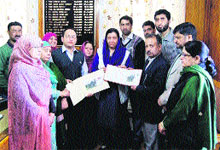 A special cover being released at the Government College for Women in Srinagar on Thursday. 