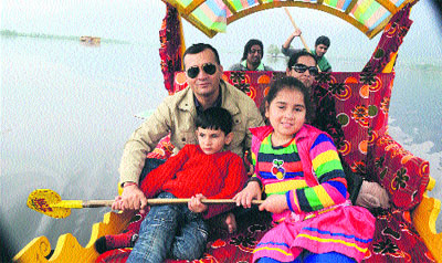 A family enjoys a shikara ride on the Dal Lake in Srinagar on Thursday. 