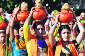 Women participate in a ‘Shobha Yatra’ on the eve of Ram Navmi in Ludhiana on Thursday.
