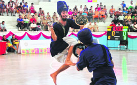Nihangs perform gatka during the opening ceremony of the basketball championship at Guru Nanak Stadium in Ludhiana on Thursday. 
