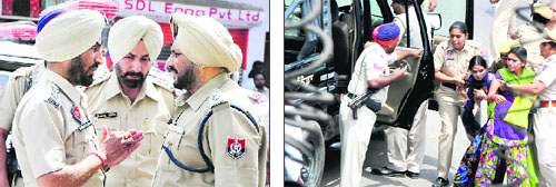 Cops detain a couple of protesters; and SSP Ravcharan Singh Brar (right) listening to DSP (City) Gurmeet Kingra while Kotwali SHO Jaspal Singh looks on at the site of protest.