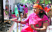 A devotee offers prayers on the concluding day of the Navratra festival