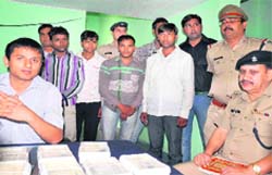 SSP Arun Mohan Joshi and SP Kiral Lal Shah with the arrested robbers at Ranipur police station in Haridwar on Friday. Tribune photo: Rameshwar Gaur