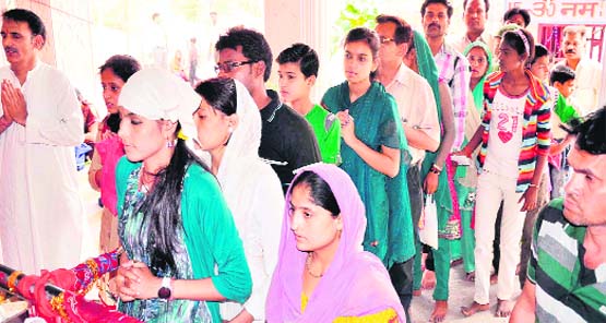 Devotees queue up to offer prayers on the last day of the Navratras at the ancient Mata Sureshwari Devi temple in Haridwar on Friday. Tribune photo: Rameshwar Gaur