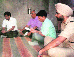 A National Commission for Scheduled Castes team at the murder victim's house in Devsar village of Bhiwani on Thursday.