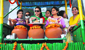 Members of an NGO at a counter set up to offer fresh drinking water in summers. 