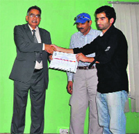 A winner being awarded after the conclusion of the symposium at BGSBU in Rajouri on Friday.