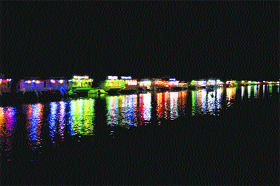 Houseboats are reflected in the waters of the Dal lake in Srinagar on Friday.