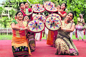 Artistes perfom during the Rongali Bihu celebrations at Nagaon in Assam on Thursday.