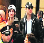 The suspects walking through the crowd in Boston on Monday