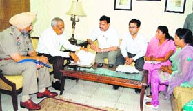 RP Mittal (second from left), IG, Border Range along with Manmohan Singh (left) SSP (Rural), appear before Raj Kumar Verka (third from left), Vice-Chairman, National SC/ST Commission, in Amritsar on Saturday