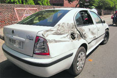 The car damaged in the incident near Government Rajindra College on Saturday.