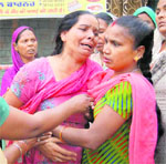An inconsolable relative of 14-year-old Rekha, who committed suicide at her home in Beant Nagar locality of the city on Saturday. 