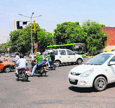 Traffic fends for itself at the Sector 20-30 junction as there were no light signals in Chandigarh on Saturday.