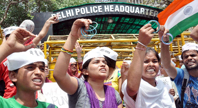 Protestors shout anti-government slogans during a demonstration against the rape of a five-year-old girl, in front of the police headquarters in New Delhi on Saturday.