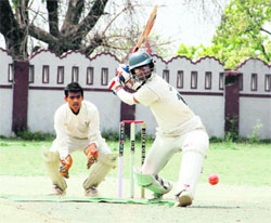 A batsman in action during a match in the 61st Dehradun District Cricket League in Dehradun on Saturday. 
