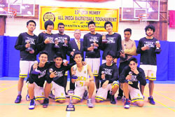 The Woodstock basketball team with the winning trophy.