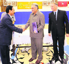 Chief Minister Vijay Bahuguna presents award to the winning team coach in Mussoorie on Saturday.