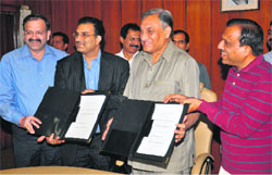 The Dharampal Satyapal group exchanges MoU documents with Uttarakhand officers in the presence of Chief Minister Vijay Bahuguna in Dehradun on Saturday. It proposes to invest Rs 400 crore in SIDCUL at Sitarganj.
