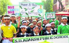 Schoolchildren take part in a rally, 'Save Water, Save Earth, Save Humanidity, in Gurgaon on Saturday.