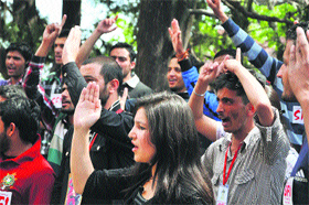 SFI activists raise anti-government slogans to protest against the rape of a five-year-old girl in New Delhi at a demonstration in Shimla on Saturday.