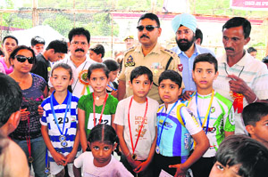 Skaters along with dignitaries during the closing ceremony of the Roller Skating Championship in Jammu on Saturday.