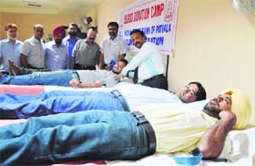 Voluteers donate blood during a camp organised by the All India State Bank of Patiala employees’ Federation in Ludhiana on Saturday