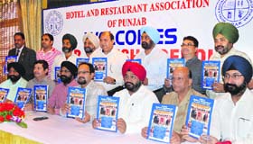 Members of the Hotel and Restaurant Association of Northern India at the launch of their directory in Ludhiana on Saturday
