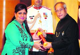 Top honour President Pranab Mukherjee presents the Padma Bhushan Award to Savita Bhatti on behalf of her husband Jaspal Bhatti at Rashtrapati Bhavan in New Delhi on Saturday