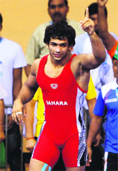 Amit Kumar celebrates his win in New Delhi.