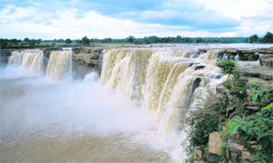 The roar of the majestic, horse-shoe shaped Chitrakot waterfall can be heard from a distance