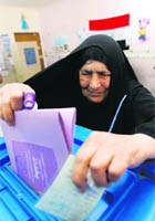A woman casts her vote for a provincial council at a polling station in Baghdad on Saturday. 