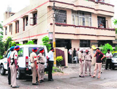 Police officials investigate the incident in which Parminder Kaur (inset) died in Amritsar on Sunday. 