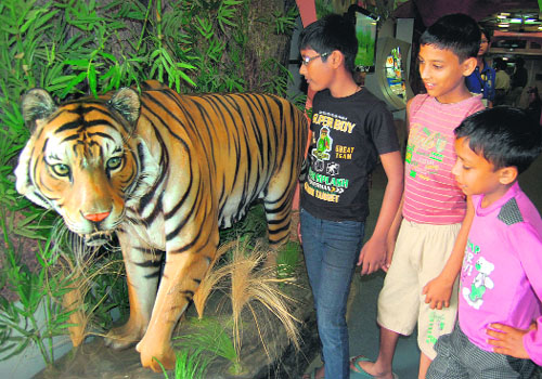 Children look at the exhibits inside the Science Express at the Verka railway station in Amritsar on Sunday. 