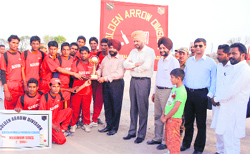 Deputy Commissioner Manjit Singh Narang giving away the trophy to the winning team of the Hussainiwala Premier League, a cricket tournament organised under the aegis of the Golden Arrow Division in Ferozepur.