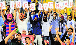 Spectators in a jubilant mood during an IPL match between Kings XI Punjab and Pune Warriors at the PCA stadium on Sunday