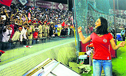 Priety Zinta throws a T-shirt at the spectators