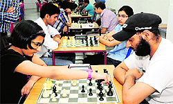 Tarni Goyal (left) makes a move against Tarandeep Singh during the final round of the chess championship at St Xaviers in Chandigarh on Sunday