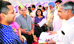 Union Railway Minister Pawan Kumar Bansal listens to grievances of Sector 50 residents in Chandigarh on Sunday