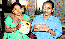 Parents of deceased Karna Bahadur show the ration provided to them by the Panchkula administration in Sector 4, Panchkula