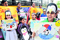 Students of Ryan International School take part in an awareness rally on the eve of Earth Day in Patiala on Sunday