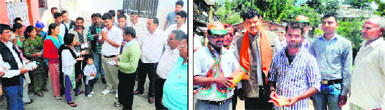 Supporters of Congress candidates seek votes for the civic bodies elections in Pithoragarh on Sunday; and (right) BJP workers do door-to-door campaigning for their candidate.