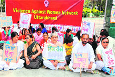 Activists of Violence Against Women Network hold a dharna at Gandhi Park in Dehradun on Sunday