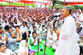 Congress MP Rao Inderjit Singh addressing a meeting of his supporters in Rewari on Sunday