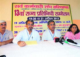 Haryana Sarvkaramchari Sangh leaders address a press conference in Kaithal on Sunday