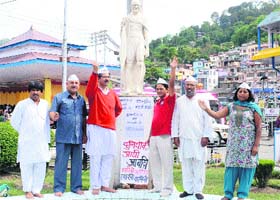 Activists of the Aam Aadmi Party protest against the rape of a five-year-old girl in New Delhi, in Mandi on Sunday