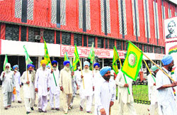 Members of the Bharti Kisan Union head towards the Desh Bhagat Yadgaar Hall during the Ghadar centenary celebrations in Jalandhar on Sunday. 