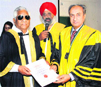 Cabinet Minister Bhagat Chunn Lal honoures Dr Abdul Majid Chaudhary, president of SAARC Surgical and principal of Lahore Medical College, during a conference at the PIMS in Jalandhar on Sunday.