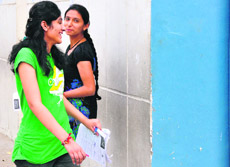 Girl students look relaxed after taking their examination in Ludhiana on Sunday.