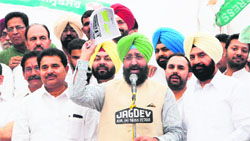 Partap Singh Bajwa, PPCC chief, addresses party activists during a district-level protest against power tariff hike in Amritsar on Sunday. 